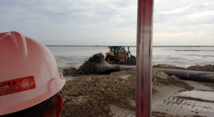 Long distance sediment pipeline. If nature can't build it, men in white hard hats with 5 miles of pipeline and infinite horsepower can. It's only land if you can walk on it. Safety and bug spray first, though. 
